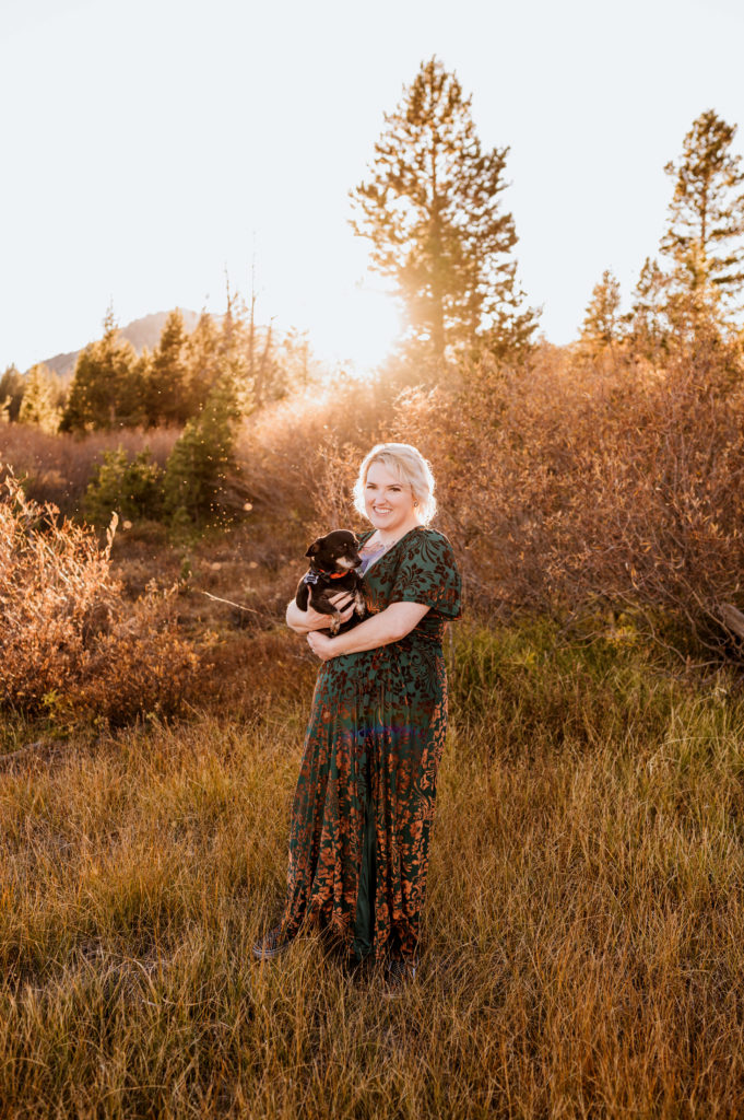 A woman and her dog at sunset in Lake Tahoe.