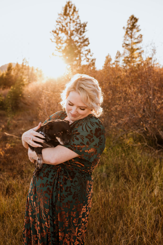 A woman hugging her dog in Lake Tahoe.