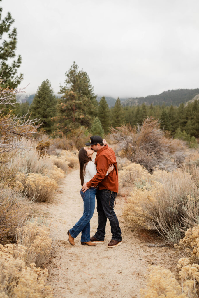 A couple kissing during an engagement session in Washoe Valley, Nevada.