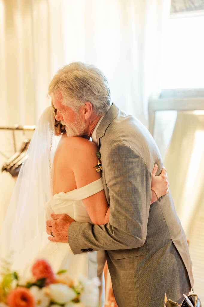 Zephyr Lodge bride hugging father