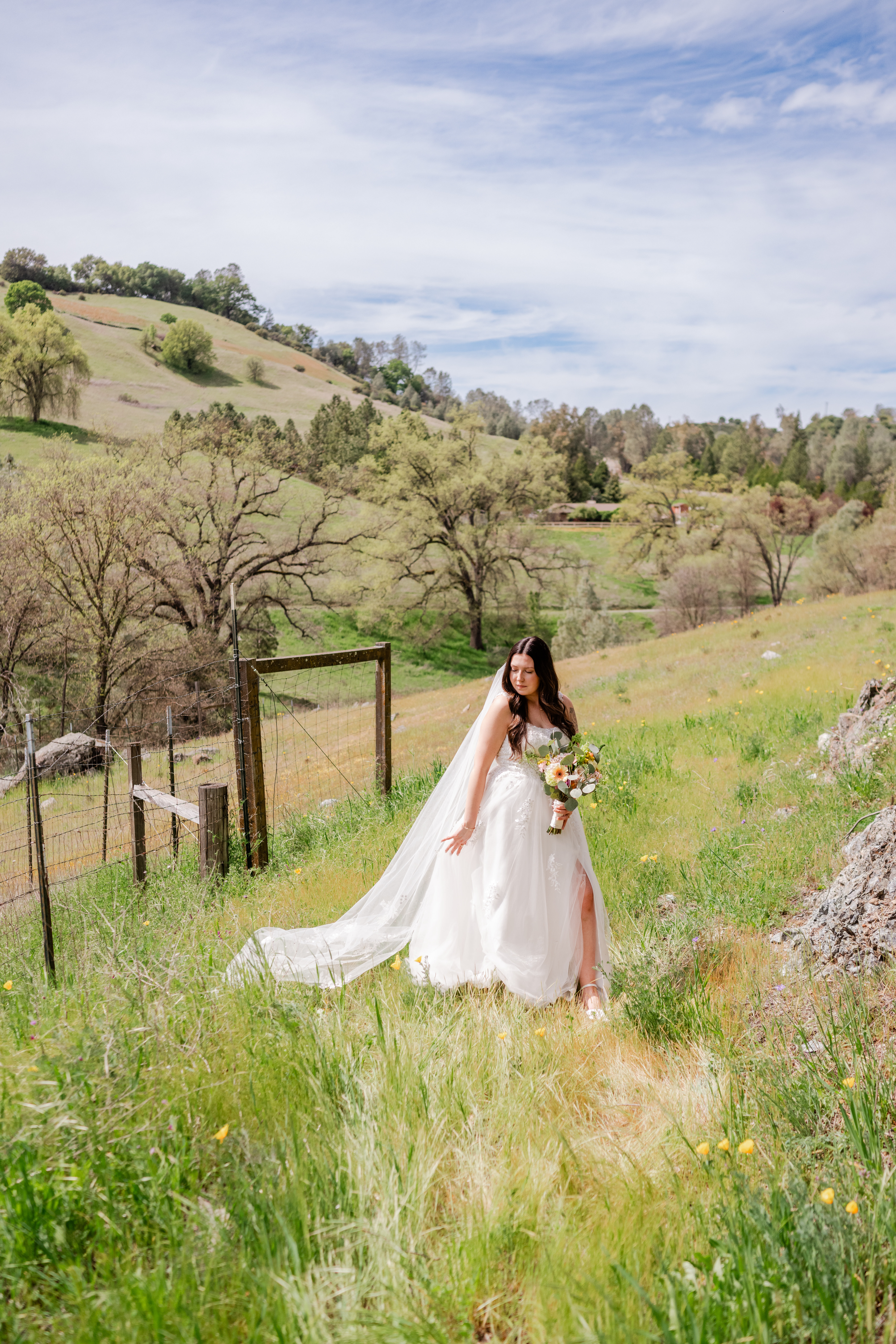 A bride poses at Eden Vale Inn in the meadow