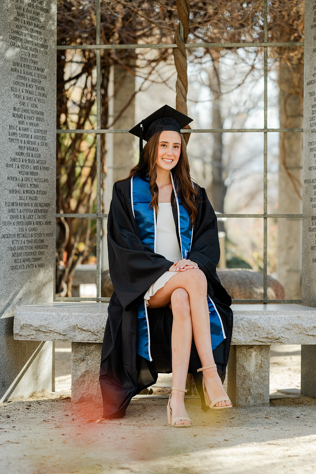 UNR grad photos cap and gown senior portrait University of Nevada Reno campus